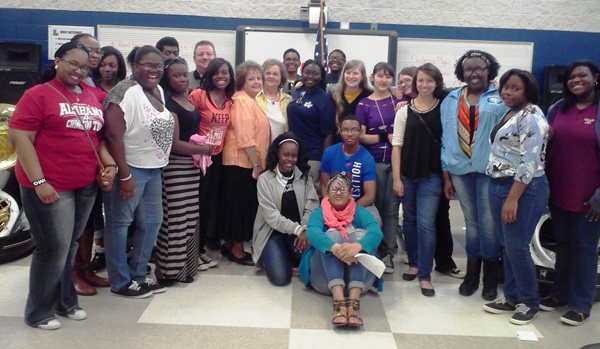 Fran Bishop with band members and school faculty together at Lee High School.